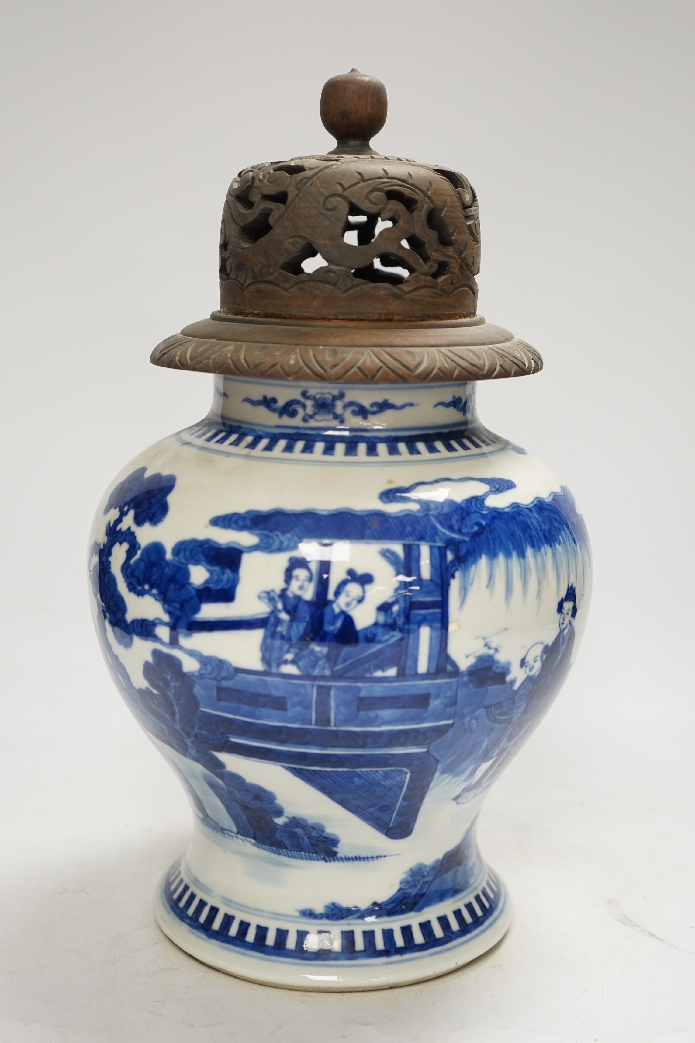 A 19th century Chinese blue and white baluster jar, painted with a scene from the Romance of the Western chamber, wood cover, 34cm. Condition - good